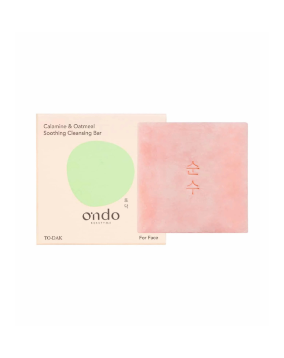 Limpiador facial sólido con calamina y avena para cara y cuerpo. Fórmula syndet vegana, sin sulfatos ni perfume, calma y repara pieles secas y sensibles.
